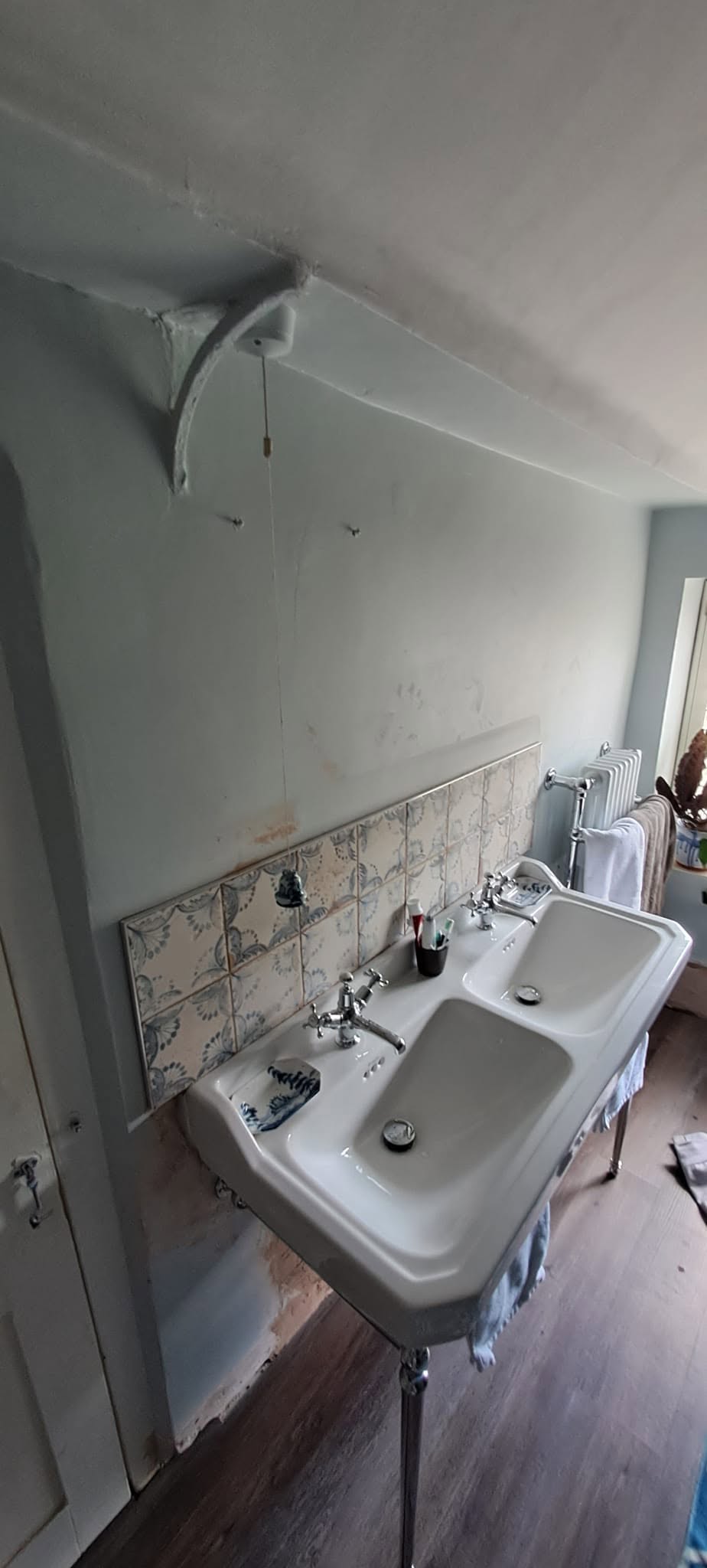 Double basin on a stand with the walls around it being prepared